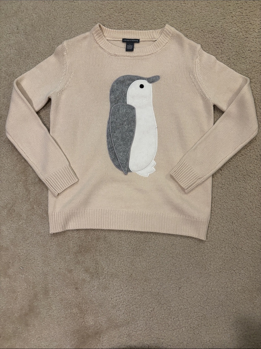 Chelsea & Theodore Cream Crewneck Sweater with Gray Penguin Appliqué
